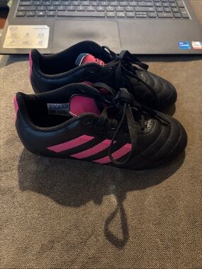 Adidas pink and black cleats